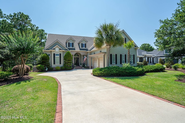 6601 Annesbrook Pl, Ocean Isle Beach, NC 28469 - view of front of home with concrete driveway, a front lawn, and an attached garage