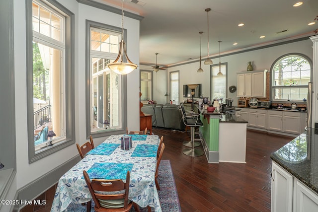 6601 Annesbrook Pl, Ocean Isle Beach, NC 28469 - dining area with crown molding, dark wood-style floors, ceiling fan, and recessed lighting