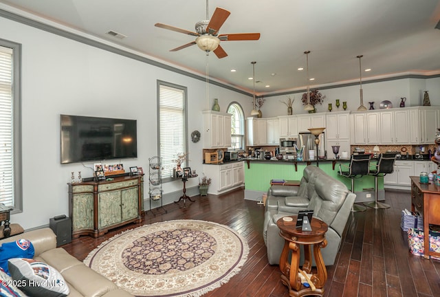 6601 Annesbrook Pl, Ocean Isle Beach, NC 28469 - living area with a ceiling fan, dark wood finished floors, recessed lighting, and crown molding