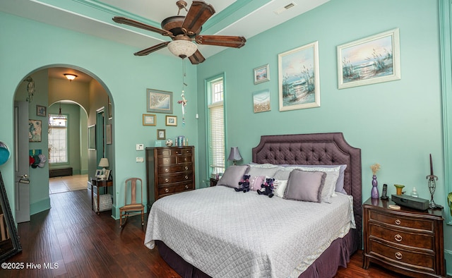 6601 Annesbrook Pl, Ocean Isle Beach, NC 28469 - bedroom featuring arched walkways, wood finished floors, and ensuite bath