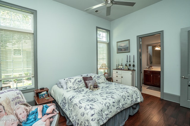 6601 Annesbrook Pl, Ocean Isle Beach, NC 28469 - bedroom with dark wood-style flooring, multiple windows, and ensuite bath