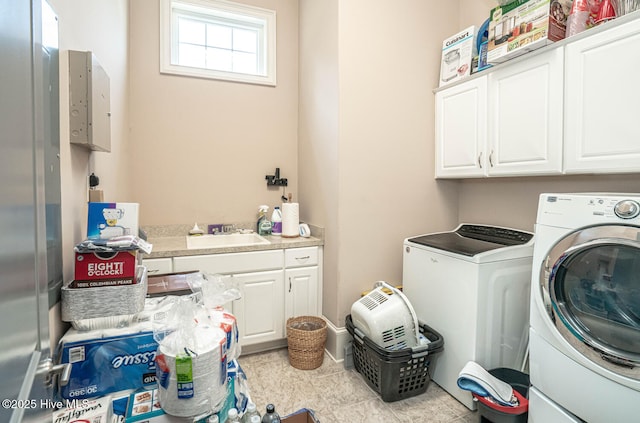 6601 Annesbrook Pl, Ocean Isle Beach, NC 28469 - laundry area featuring cabinet space and washer and clothes dryer