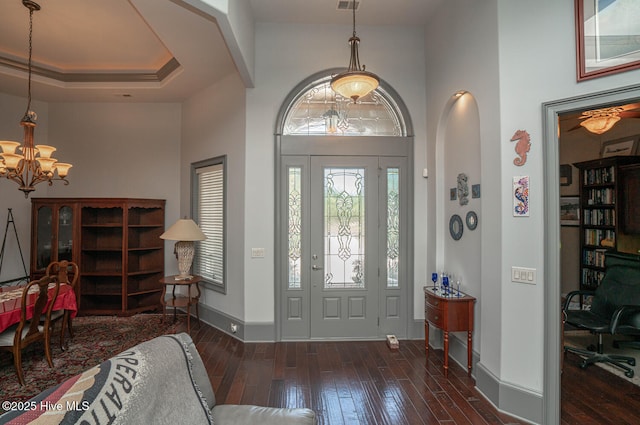 6601 Annesbrook Pl, Ocean Isle Beach, NC 28469 - entrance foyer with a chandelier, wood-type flooring, and a towering ceiling