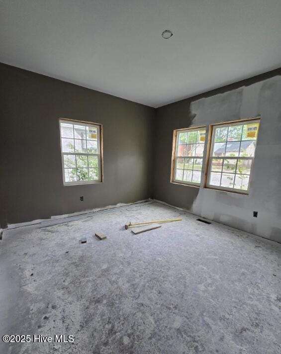 827 Sunset Ave, Rocky Mount, NC 27804 - carpeted empty room featuring plenty of natural light