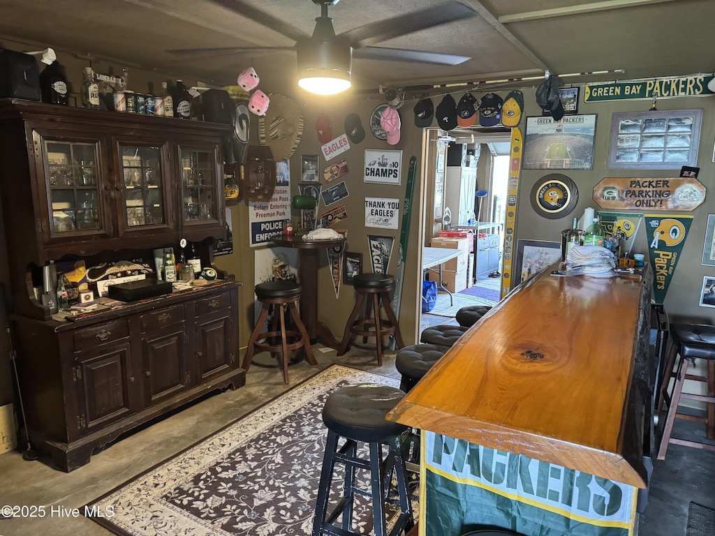 202 Lewis Dr Unit 1212, Carolina Beach, NC 28428 - bar with a ceiling fan and concrete flooring