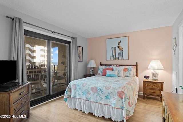 1505 Salter Path Rd Unit 236, Indian Beach, NC 28512 - bedroom featuring light wood-style flooring and access to exterior