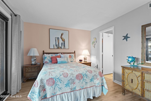 1505 Salter Path Rd Unit 236, Indian Beach, NC 28512 - bedroom featuring wood finished floors and baseboards