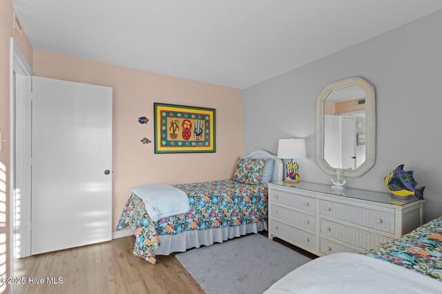 1505 Salter Path Rd Unit 236, Indian Beach, NC 28512 - bedroom featuring wood finished floors and baseboards