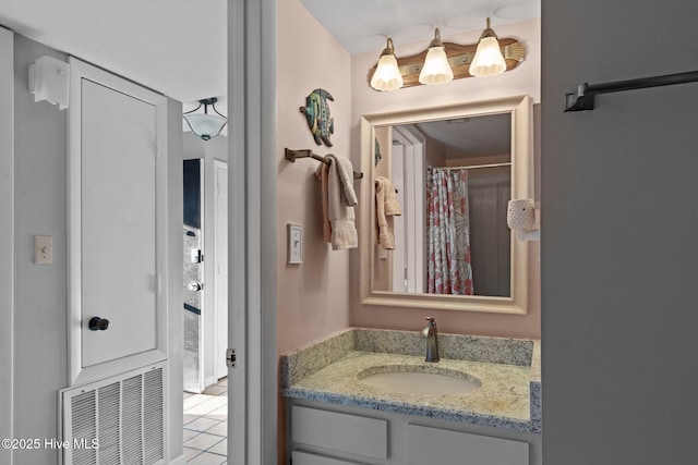 1505 Salter Path Rd Unit 236, Indian Beach, NC 28512 - full bathroom featuring vanity, tile patterned flooring, and curtained shower