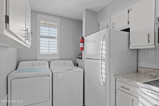 1505 Salter Path Rd Unit 236, Indian Beach, NC 28512 - laundry room featuring a textured ceiling and washer and clothes dryer