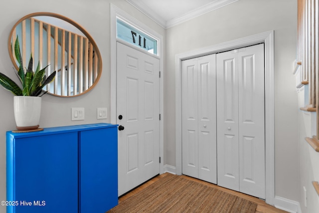 117 S 8th St, Wilmington, NC 28401 - foyer entrance with light wood-style flooring and crown molding