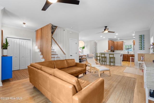 117 S 8th St, Wilmington, NC 28401 - living area with ceiling fan, light wood finished floors, stairway, ornamental molding, and recessed lighting