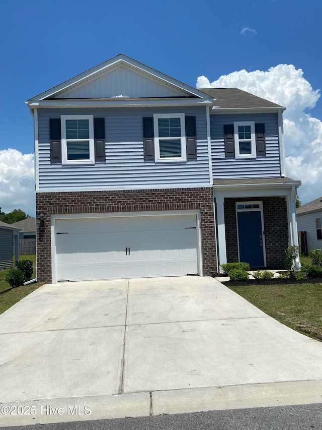 109 Mesa Ln, Holly Ridge, NC 28445 - view of front of property with brick siding, an attached garage, and concrete driveway