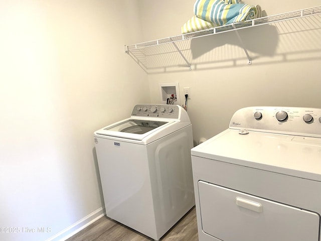 109 Mesa Ln, Holly Ridge, NC 28445 - laundry area with washing machine and clothes dryer and wood finished floors