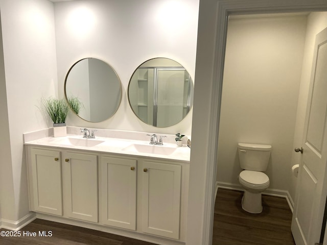 109 Mesa Ln, Holly Ridge, NC 28445 - bathroom featuring wood finished floors and double vanity