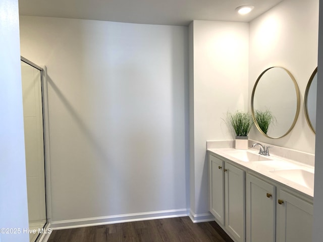 109 Mesa Ln, Holly Ridge, NC 28445 - full bathroom featuring wood finished floors, double vanity, and a shower with door