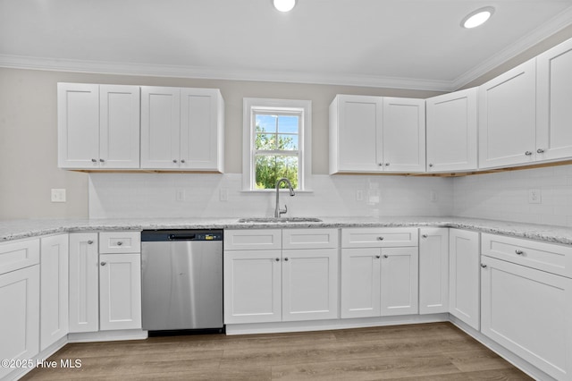 92 Hampton Way, Snow Hill, NC 28580 - kitchen featuring dishwasher, crown molding, white cabinets, backsplash, and light wood-style flooring