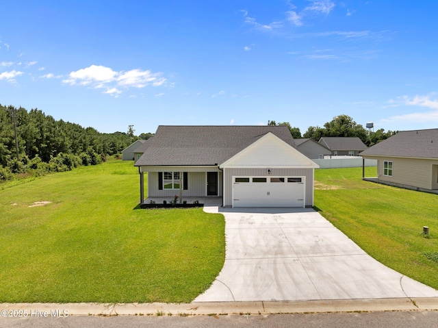 92 Hampton Way, Snow Hill, NC 28580 - view of front facade with an attached garage, concrete driveway, board and batten siding, and a front yard