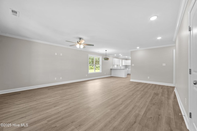 92 Hampton Way, Snow Hill, NC 28580 - unfurnished living room with ceiling fan, ornamental molding, recessed lighting, and light wood-style floors