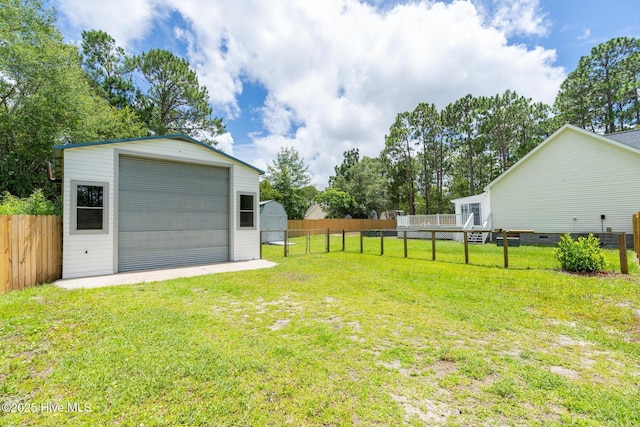 448 Edgewood & Rd, Southport, NC 28461 - fenced backyard with an outdoor structure and a garage