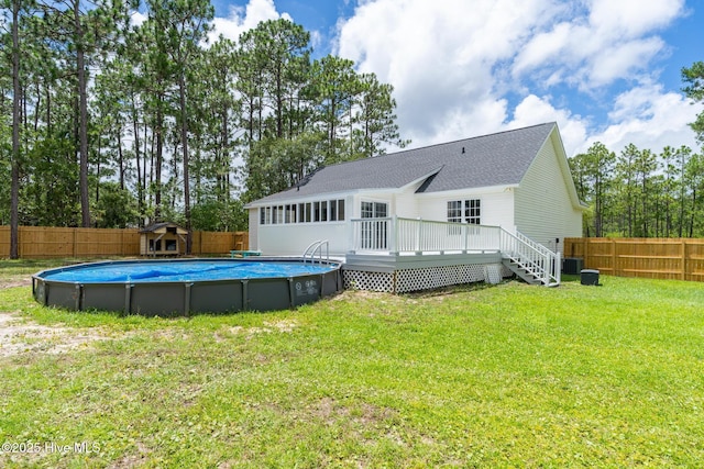 448 Edgewood & Rd, Southport, NC 28461 - rear view of property with a deck, a fenced backyard, and a shingled roof