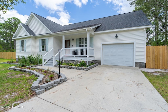 448 Edgewood & Rd, Southport, NC 28461 - ranch-style home with a porch, concrete driveway, an attached garage, and a shingled roof