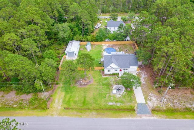 448 Edgewood & Rd, Southport, NC 28461 - aerial view of property and surrounding area featuring a heavily wooded area