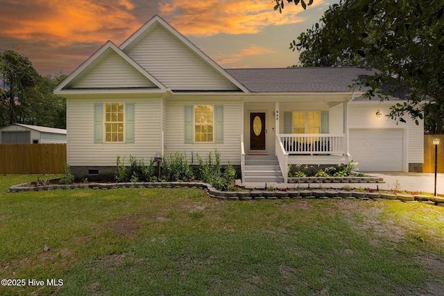 448 Edgewood & Rd, Southport, NC 28461 - view of front facade featuring a porch, a garage, concrete driveway, and crawl space