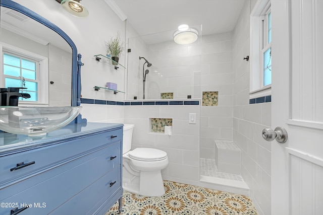 8 Gate 2, Carolina Shores, NC 28467 - full bath with a walk in shower, tile patterned flooring, vanity, tile walls, and crown molding