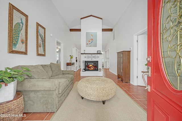 8 Gate 2, Carolina Shores, NC 28467 - tiled living area with a glass covered fireplace and high vaulted ceiling