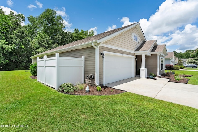767 Heather Glen Ln, Calabash, NC 28467 - view of side of home featuring driveway, an attached garage, a yard, and a shingled roof