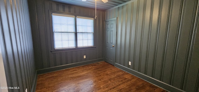 907 Raleigh Rd, Clinton, NC 28328 - unfurnished room with dark wood-style floors, a ceiling fan, and crown molding
