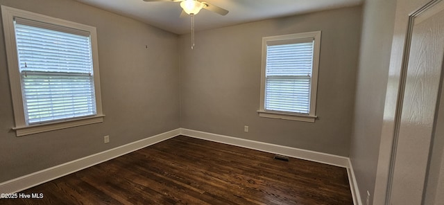 907 Raleigh Rd, Clinton, NC 28328 - empty room featuring ceiling fan, dark wood finished floors, and healthy amount of natural light