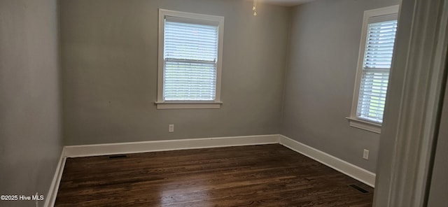 907 Raleigh Rd, Clinton, NC 28328 - empty room with dark wood-style floors and a ceiling fan