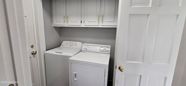 907 Raleigh Rd, Clinton, NC 28328 - laundry room with washer and clothes dryer and cabinet space