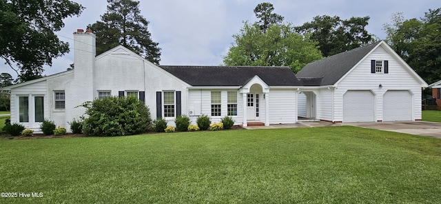 907 Raleigh Rd, Clinton, NC 28328 - view of front of house with a front lawn, concrete driveway, a chimney, and roof with shingles