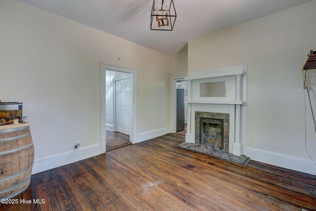 305 Mcrae St, Wilmington, NC 28401 - unfurnished living room featuring wood finished floors and a fireplace with raised hearth