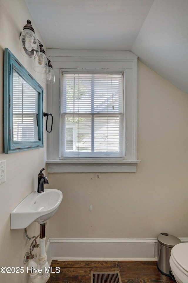 305 Mcrae St, Wilmington, NC 28401 - half bath featuring lofted ceiling and wood finished floors