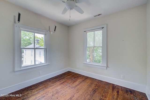 305 Mcrae St, Wilmington, NC 28401 - unfurnished room with dark wood finished floors and a ceiling fan