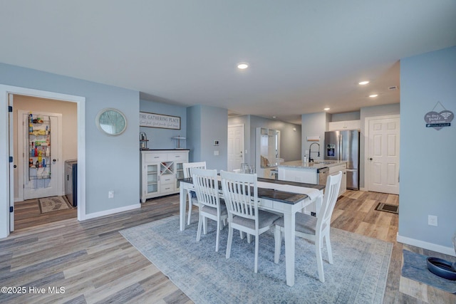 870 Westway Rd, Southport, NC 28461 - dining space featuring light wood-type flooring and recessed lighting