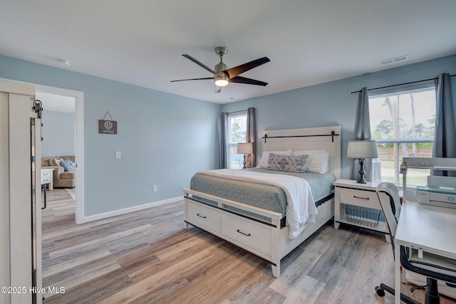 870 Westway Rd, Southport, NC 28461 - bedroom with light wood-style floors and a ceiling fan