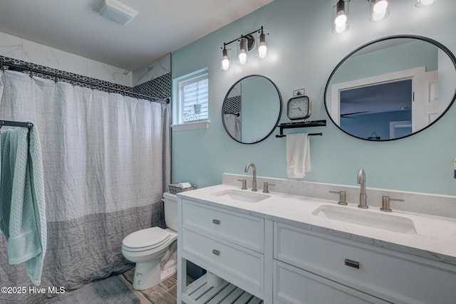 870 Westway Rd, Southport, NC 28461 - bathroom with double vanity, a shower with shower curtain, and wood finished floors