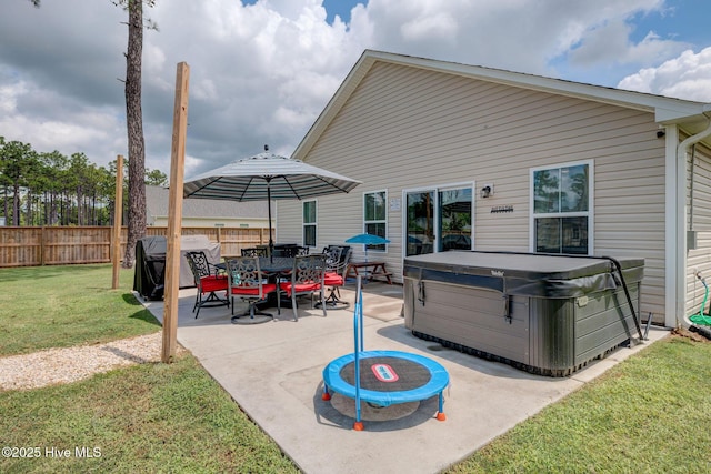 870 Westway Rd, Southport, NC 28461 - fenced backyard with a hot tub, a patio area, and a grill