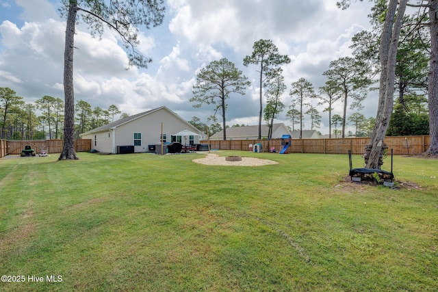 870 Westway Rd, Southport, NC 28461 - fenced backyard with a playground and an outdoor fire pit