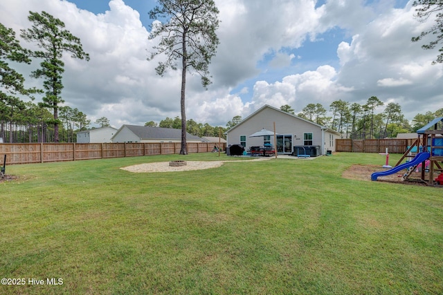 870 Westway Rd, Southport, NC 28461 - fenced backyard with a playground and a fire pit
