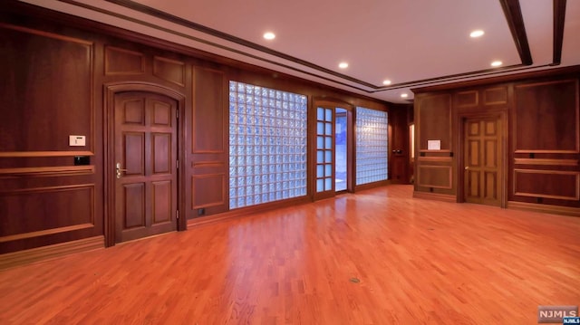 interior space with hardwood / wood-style flooring and ornamental molding