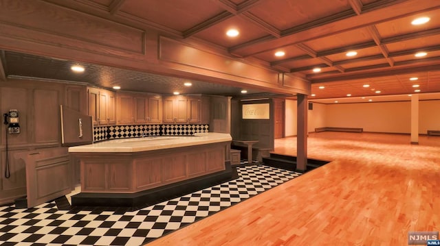 misc room featuring coffered ceiling, beamed ceiling, dark hardwood / wood-style floors, decorative columns, and ornamental molding