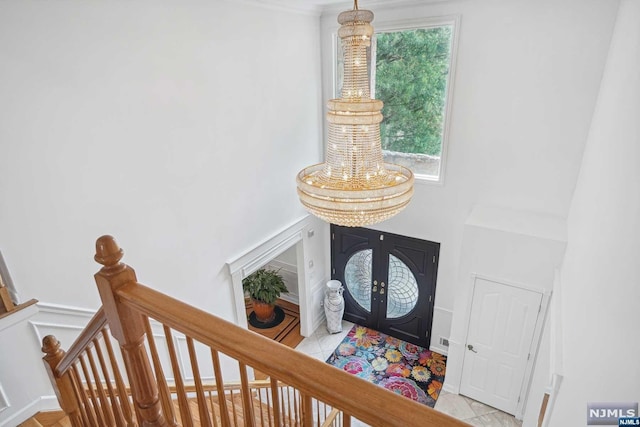 entrance foyer with french doors and light tile patterned floors