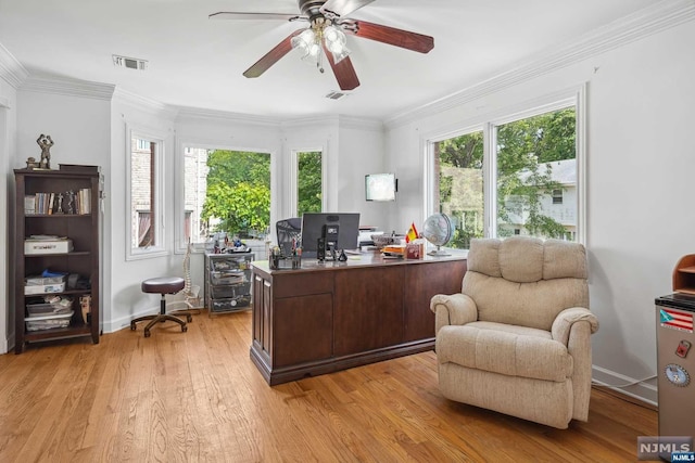 office area with ceiling fan, ornamental molding, and light wood-type flooring