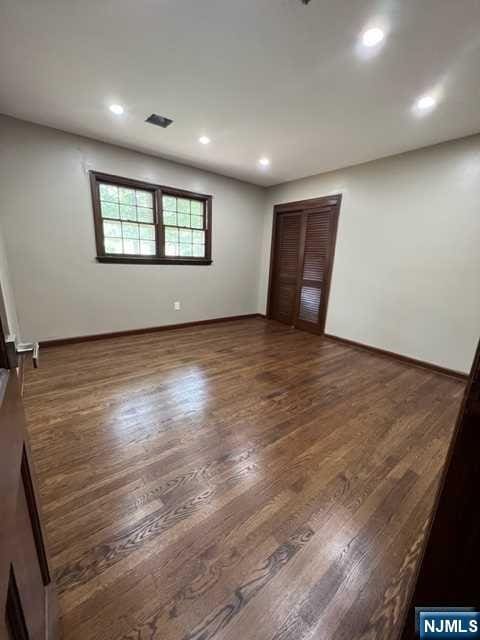 empty room featuring dark hardwood / wood-style floors